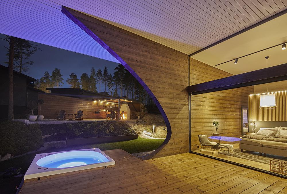 Luksusowy dom z bali w kształcie fali. (Zdjęcie: Hans Koistinen)