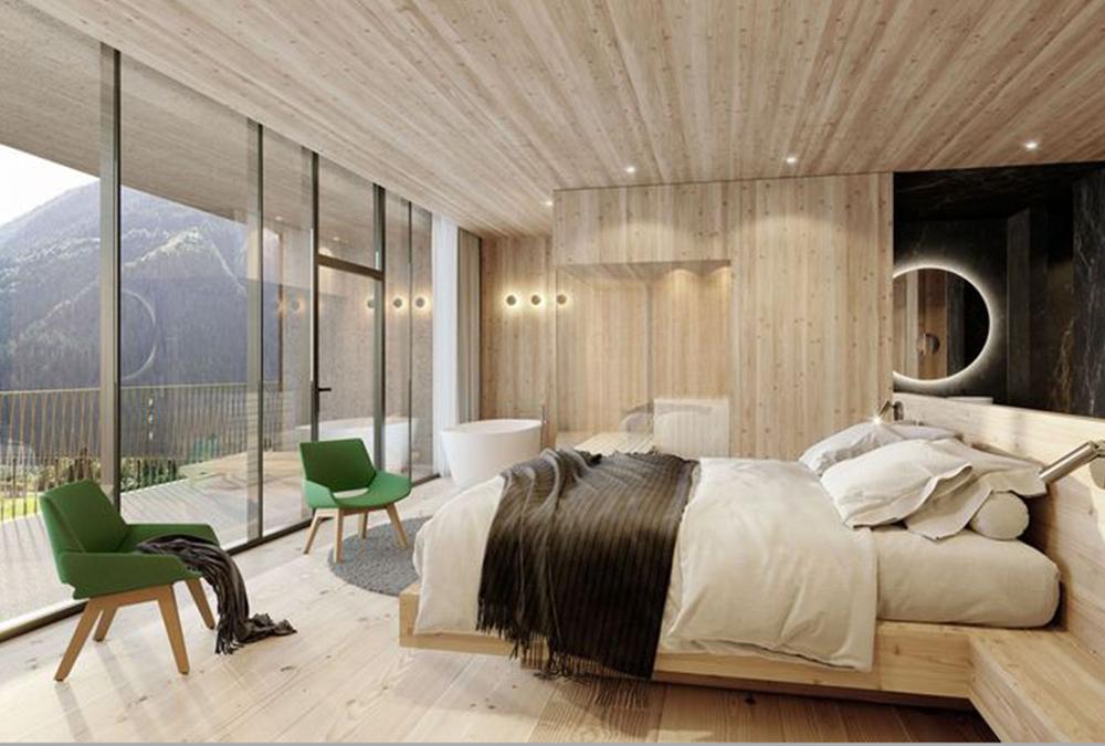 Komfort in Holz: Die meisten OLM Apart-Suiten verfügen über eigene Sauna, freistehende Badewanne und Kochnische. (Bild: OLM)