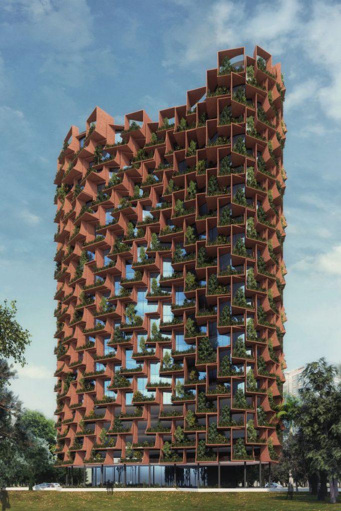 The Forest Sanjay Puri - die Fassade mutet dank der Farbgebung wie die rötliche Erde in Afrika an