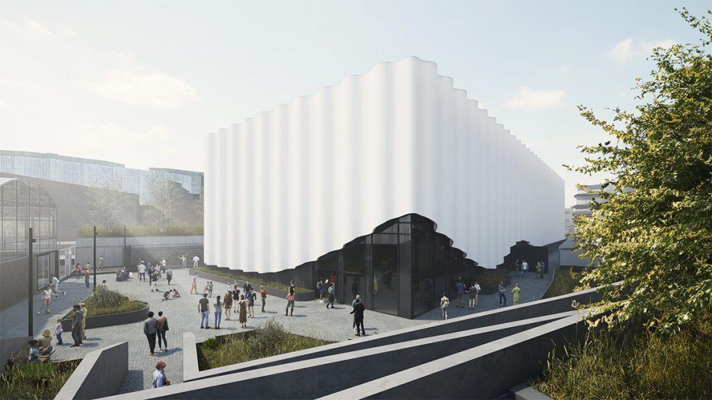 Tagsüber sorgt schon allein die gewellte Außenhaut des Neubaus für lebendige Lichtspiele. (Bild: UAU Studio)